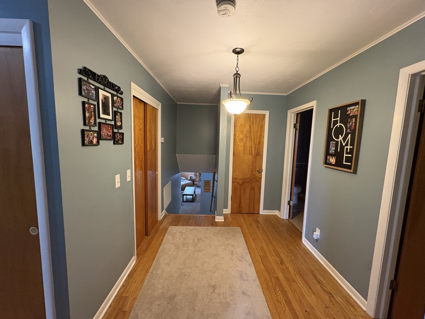 320 South Main Street Creston, IL 61068 - Photo 24 of 34 a view of a hallway with wooden floor and furniture