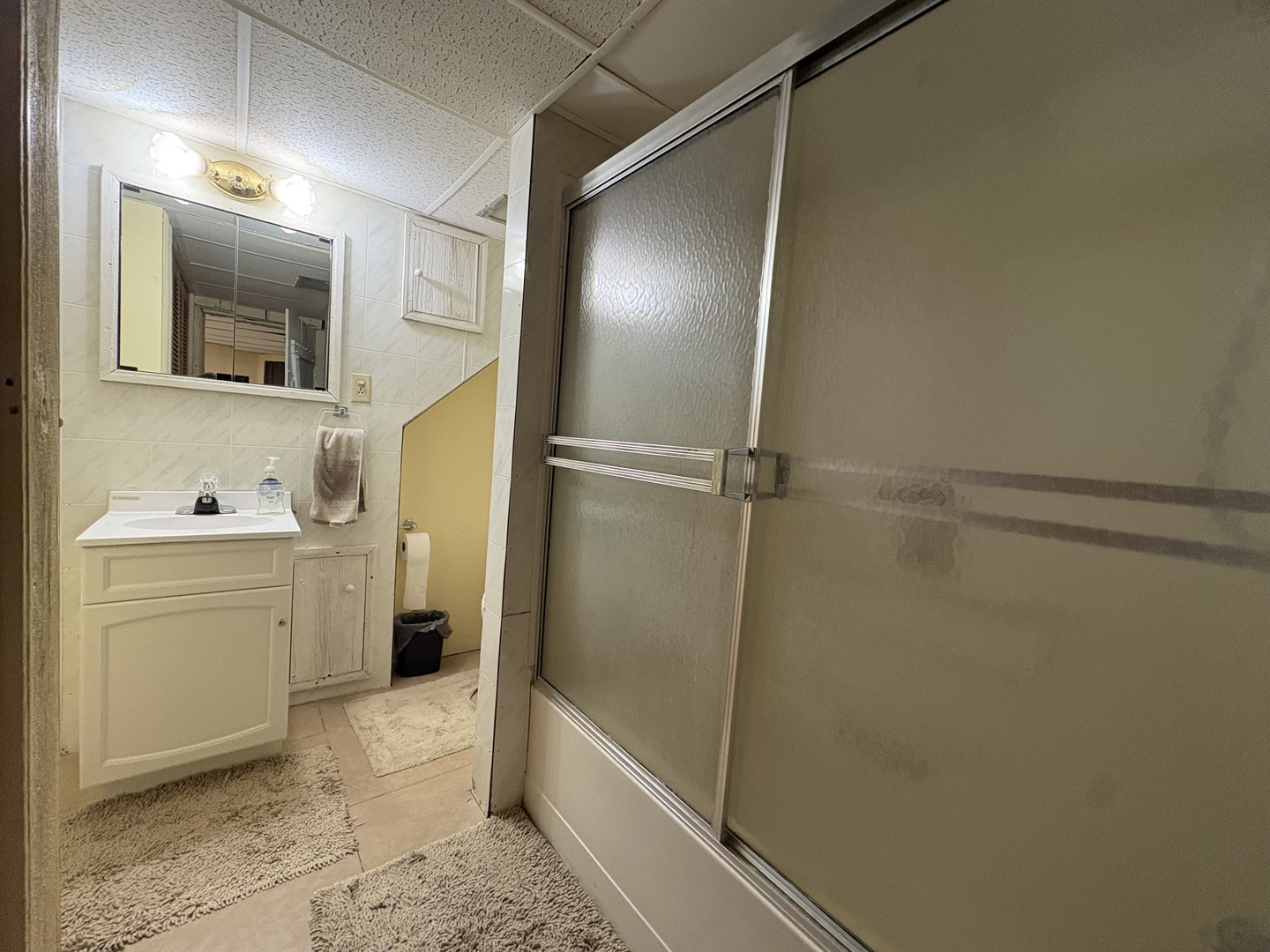 320 South Main Street Creston, IL 61068 - Photo 26 of 34 a bathroom with a sink and mirror