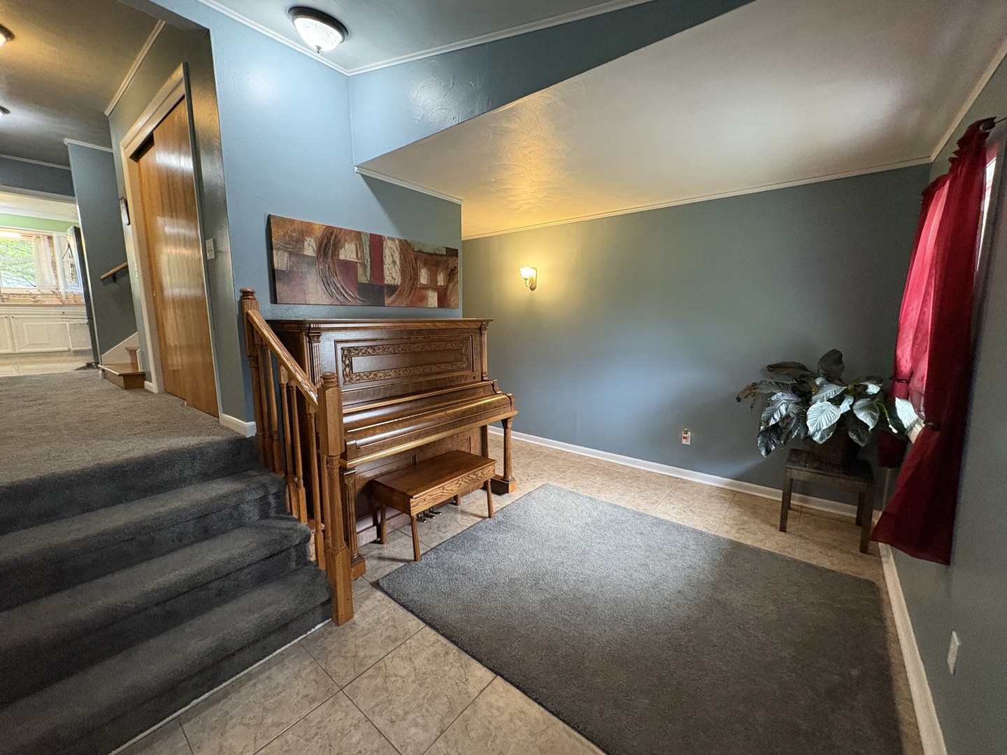 320 South Main Street Creston, IL 61068 - Photo 4 of 34 a room with stairs and a potted plant
