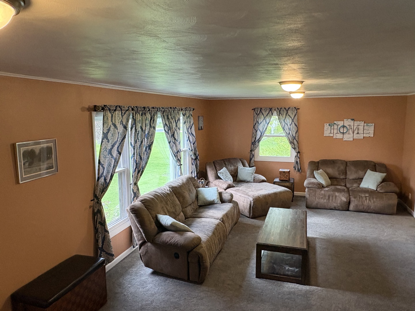 320 South Main Street Creston, IL 61068 - Photo 6 of 34 a living room with furniture a couch and a large window