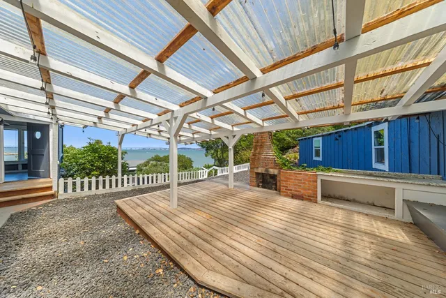 a view of a backyard with a wooden deck