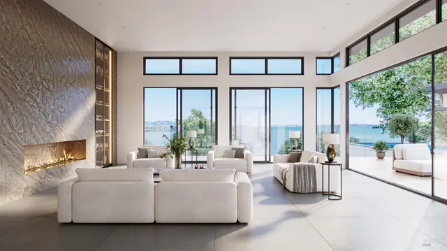 a living room with furniture and large windows