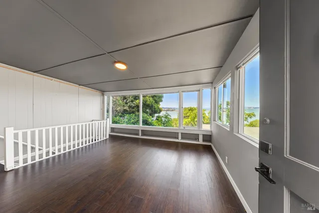 a view of room with window wooden floor and window