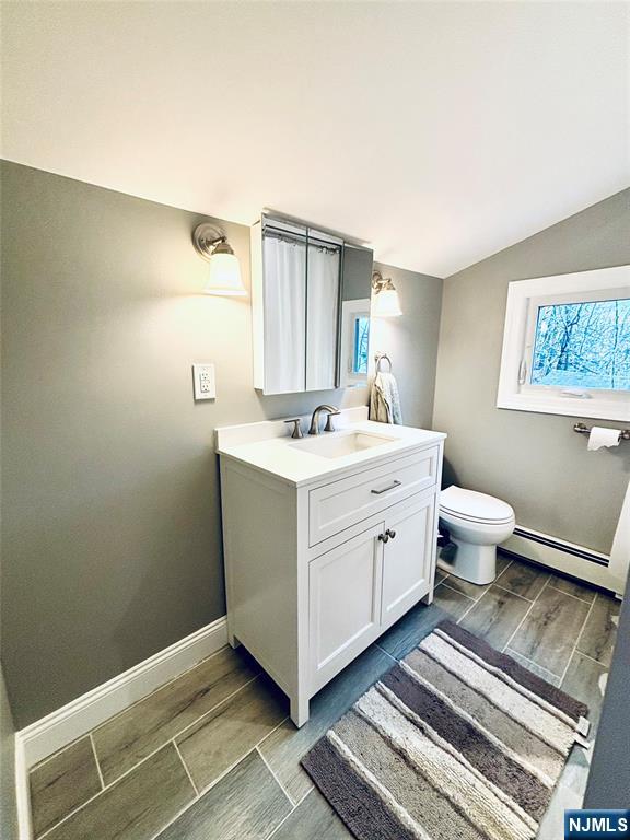 6 Bird Lane, Unit 2 Lake Hopatcong, NJ 07849 - Photo 3 of 7 a spacious bathroom with a sink toilet and a mirror