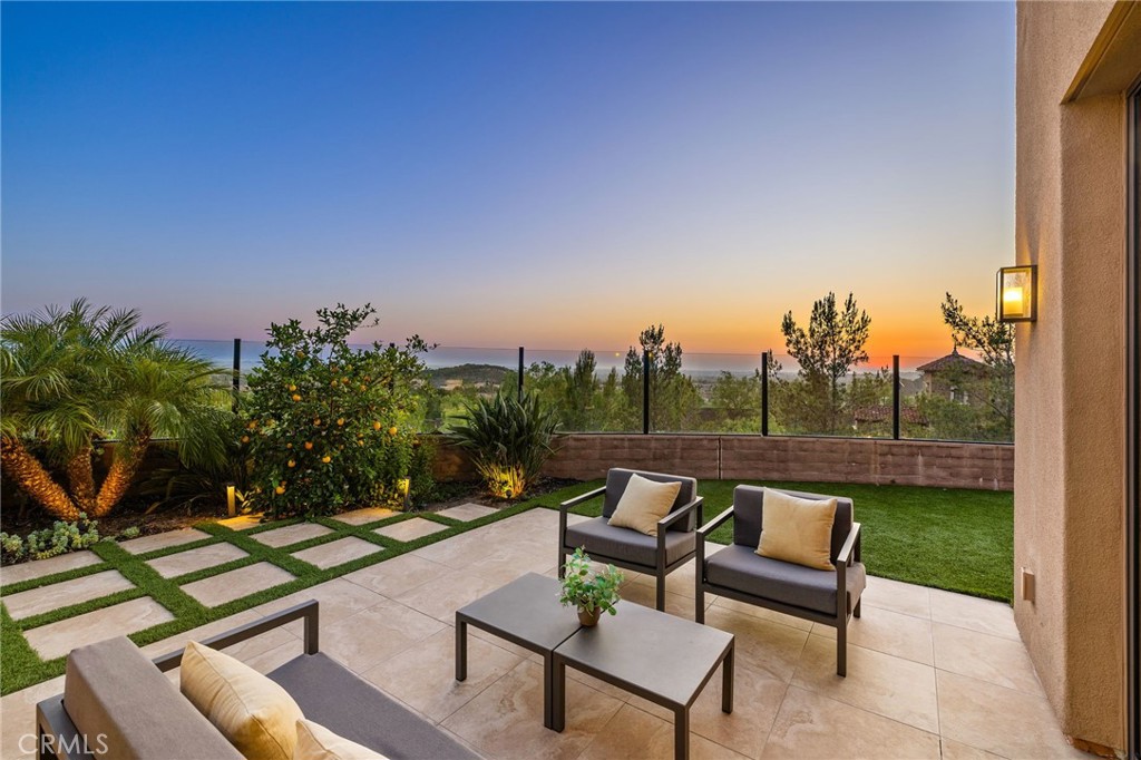 168 Bellini Irvine, CA 92602 - Photo 14 of 29 a view of a couches in a patio with a table and chairs