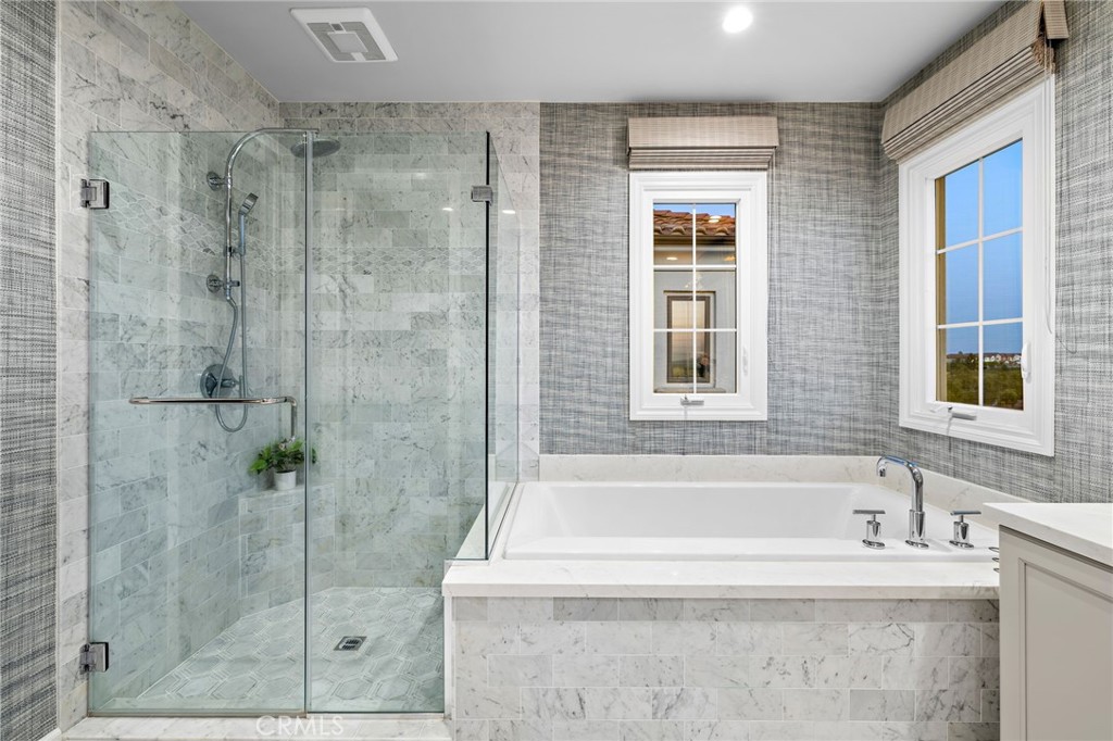 168 Bellini Irvine, CA 92602 - Photo 27 of 29 a white bath tub sitting next to a shower