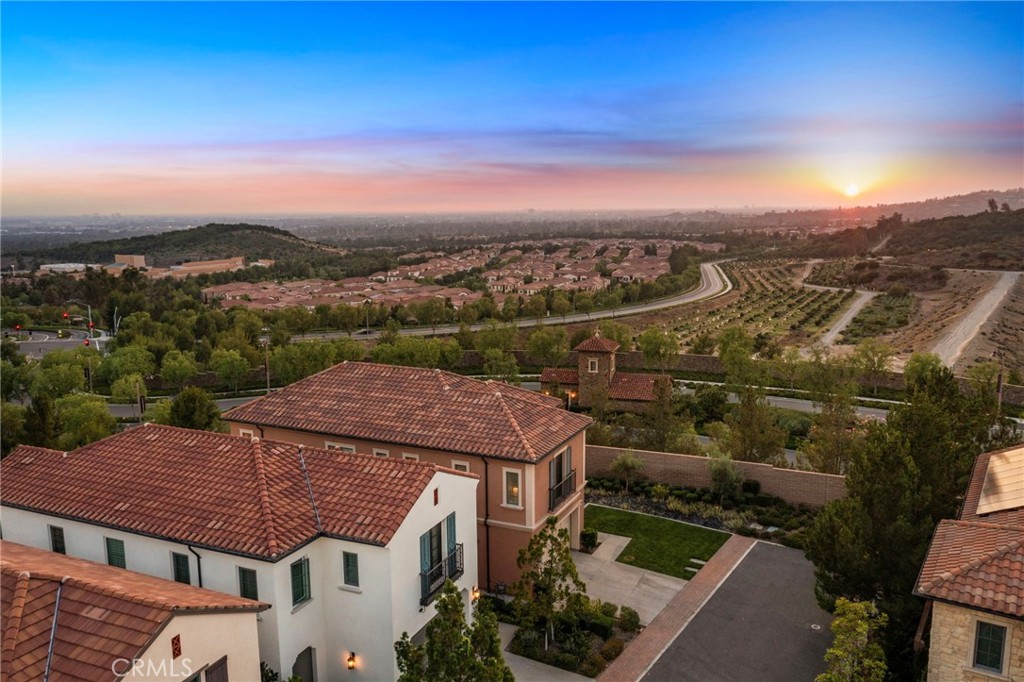 168 Bellini Irvine, CA 92602 - Photo 28 of 29 an aerial view of a house with a yard garage and lake view