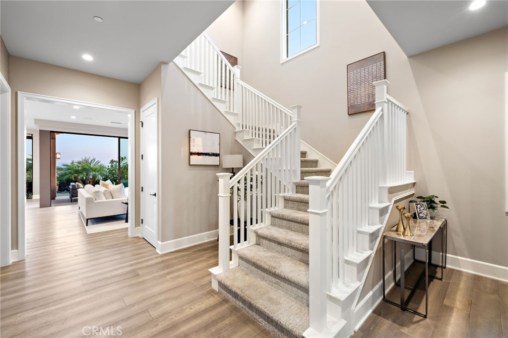 168 Bellini Irvine, CA 92602 - Photo 3 of 29 a view of entryway and hall with wooden floor