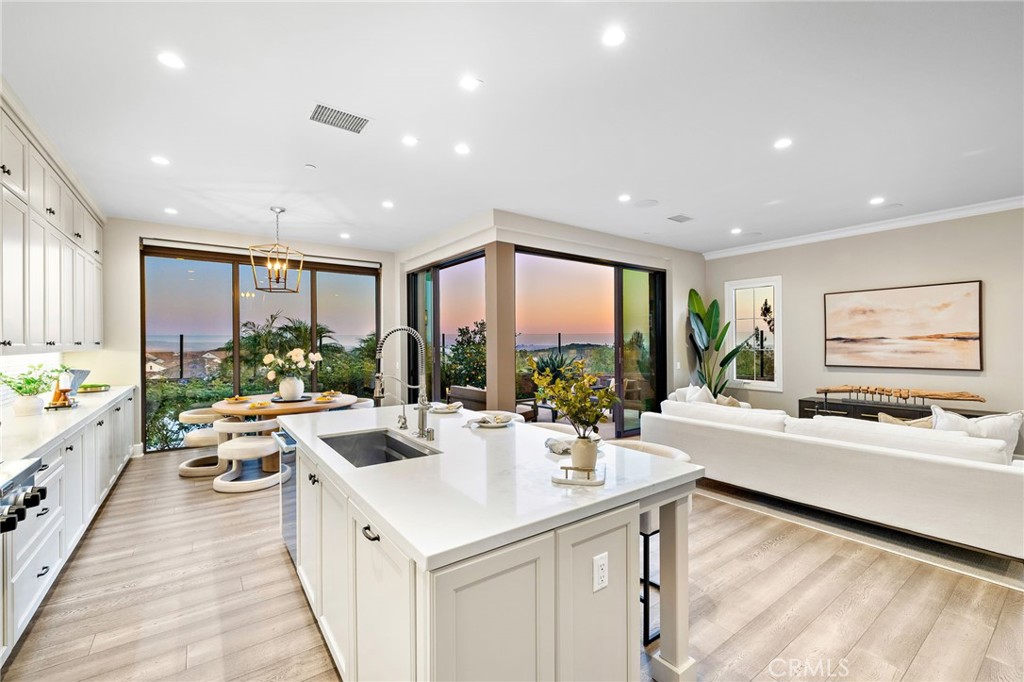 168 Bellini Irvine, CA 92602 - Photo 10 of 29 a kitchen with counter space sink and living room