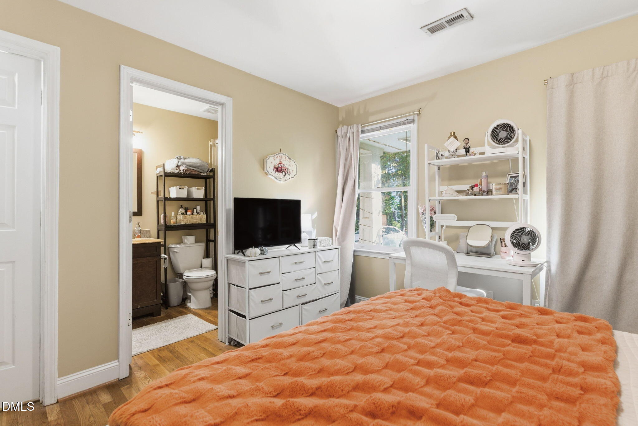 2816 Everett Avenue Raleigh, NC 27607 - Photo 20 of 44 a bedroom with a bed and a flat screen tv