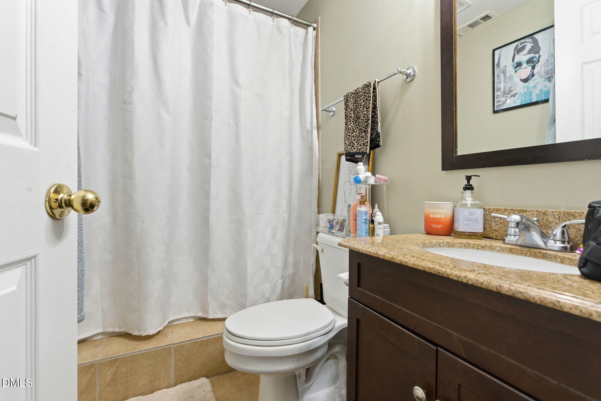 2816 Everett Avenue Raleigh, NC 27607 - Photo 33 of 44 a bathroom with a granite countertop sink vanity mirror and toilet