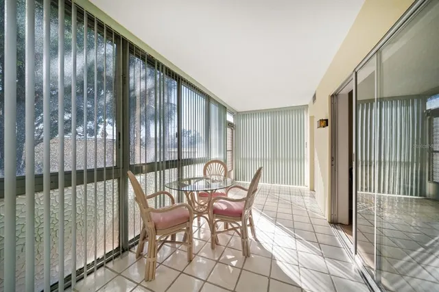 a view of a chairs and table in the balcony