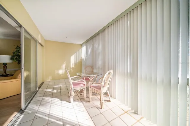 a patio with table and chairs