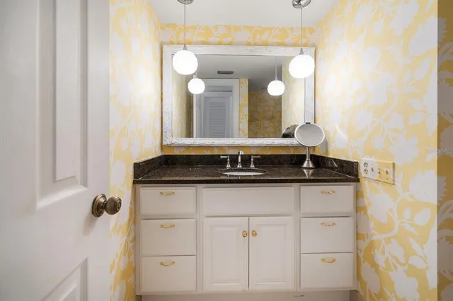 a bathroom with a sink and a mirror