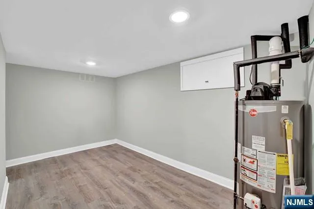 a view of hallway with wooden floor