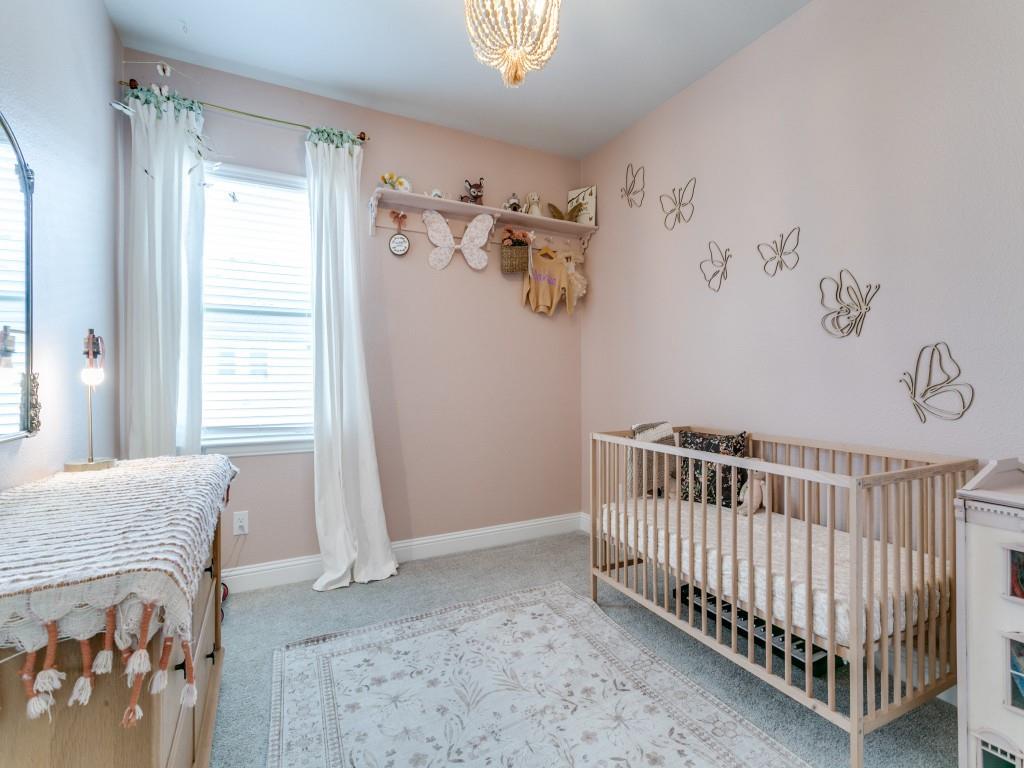 12964 Rockham Lane Dallas, TX 75234 - Photo 20 of 24 a bedroom with a bed and a window