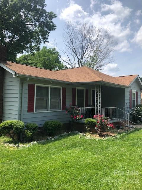 5701 Old Plank Road Charlotte, NC 28216 - Photo 2 of 10 a front view of a house with garden and porch