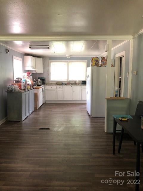 5701 Old Plank Road Charlotte, NC 28216 - Photo 4 of 10 a kitchen with stainless steel appliances wooden floor and a refrigerator