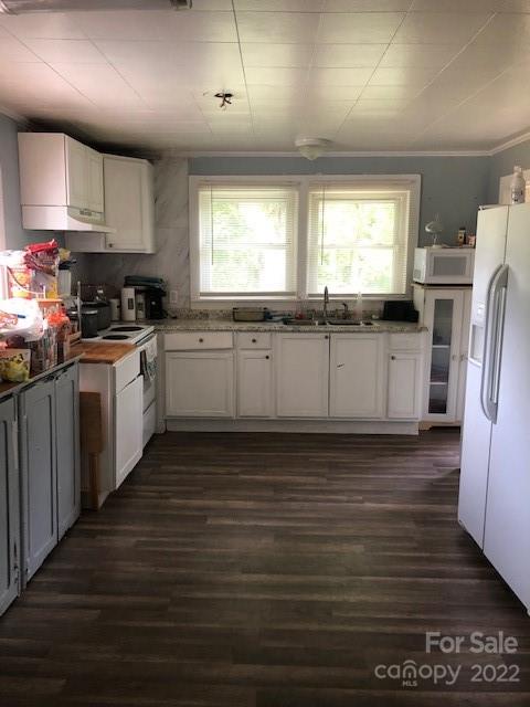 5701 Old Plank Road Charlotte, NC 28216 - Photo 5 of 10 a kitchen with stainless steel appliances granite countertop a refrigerator a sink dishwasher a stove and white countertops with wooden floor