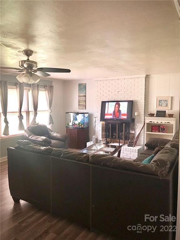 5701 Old Plank Road Charlotte, NC 28216 - Photo 7 of 10 a living room with furniture and a fireplace