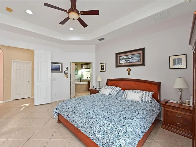 a bedroom with a bed and dresser