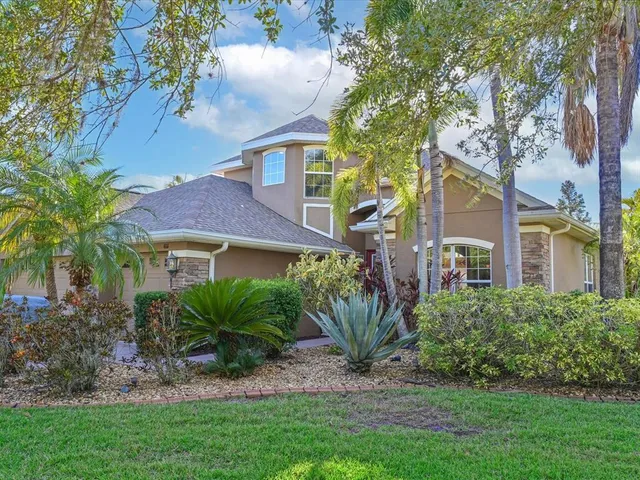 a view of a front of a house with a garden