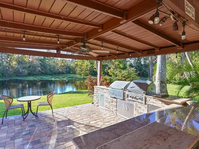 a view of a swimming pool with a patio