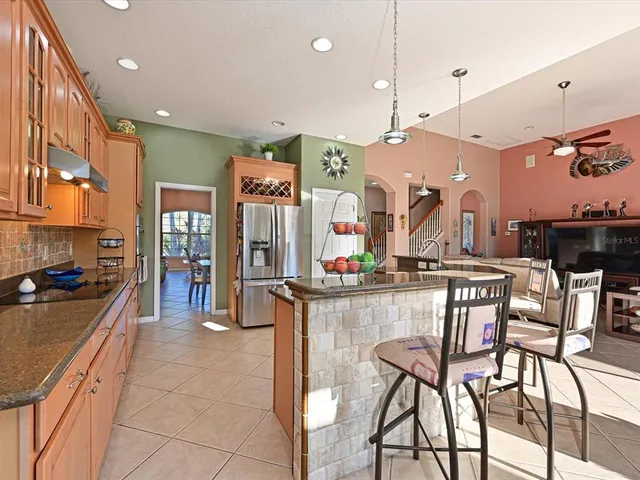 a kitchen with stainless steel appliances kitchen island a large island in the center