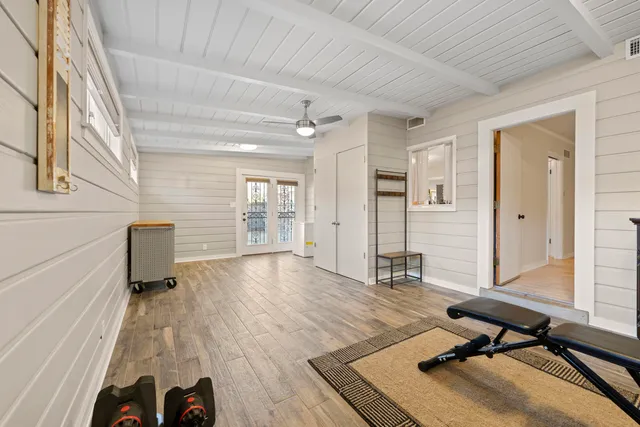 a view of a house with backyard and a sitting area