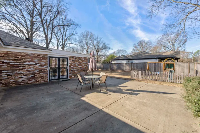 a view of a house with snow on the road
