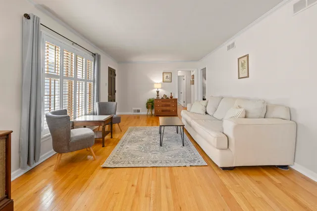 a living room with furniture and a rug