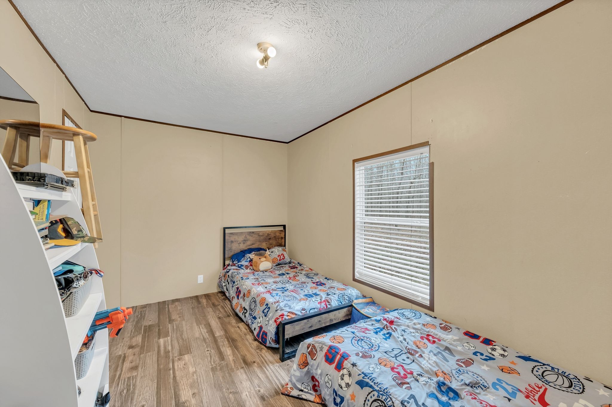 6126 Calvin Potts Road Primm Springs, TN 38476 - Photo 14 of 22 a bedroom with a bed and a window