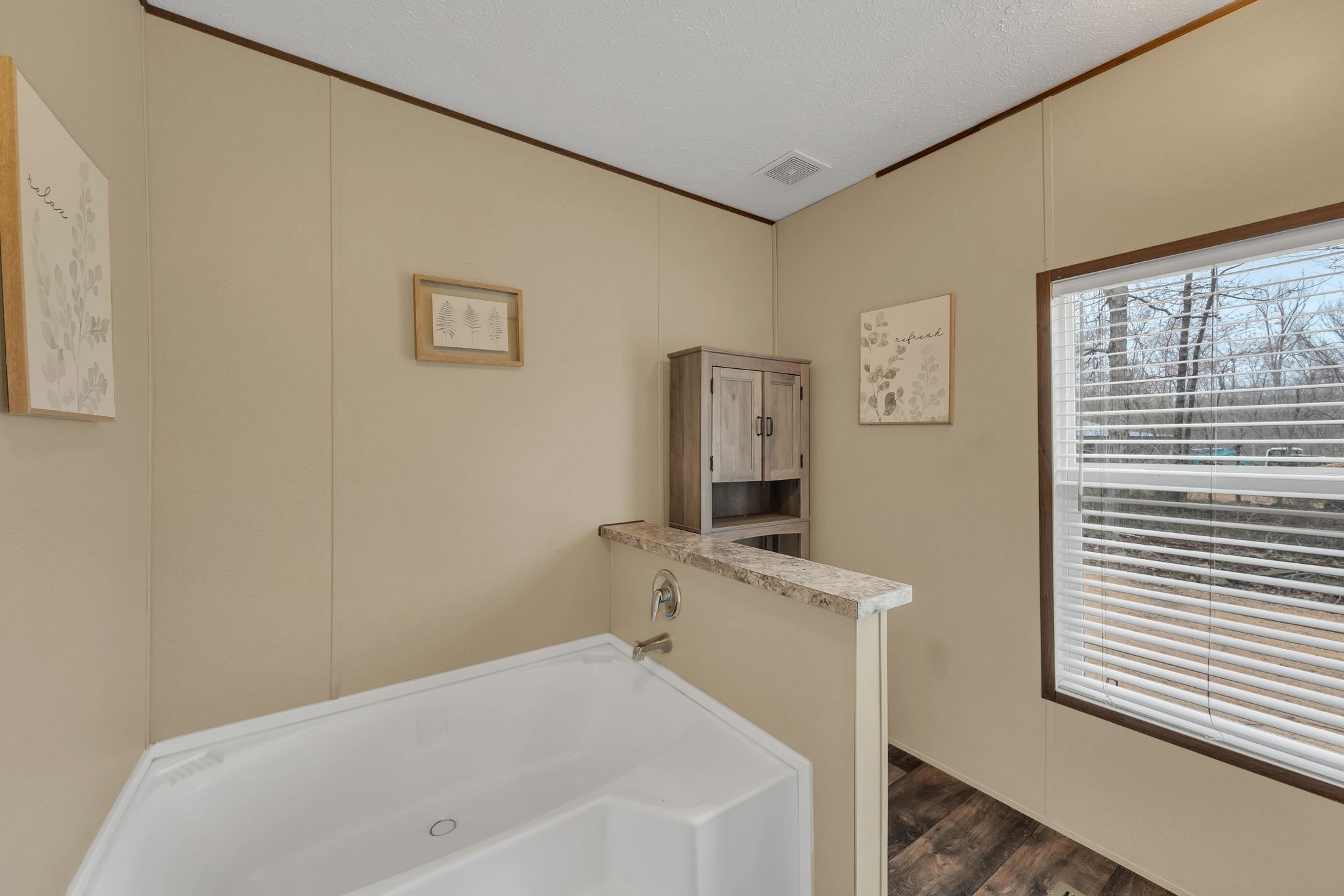 6126 Calvin Potts Road Primm Springs, TN 38476 - Photo 18 of 22 a bathroom with a bathtub and a window
