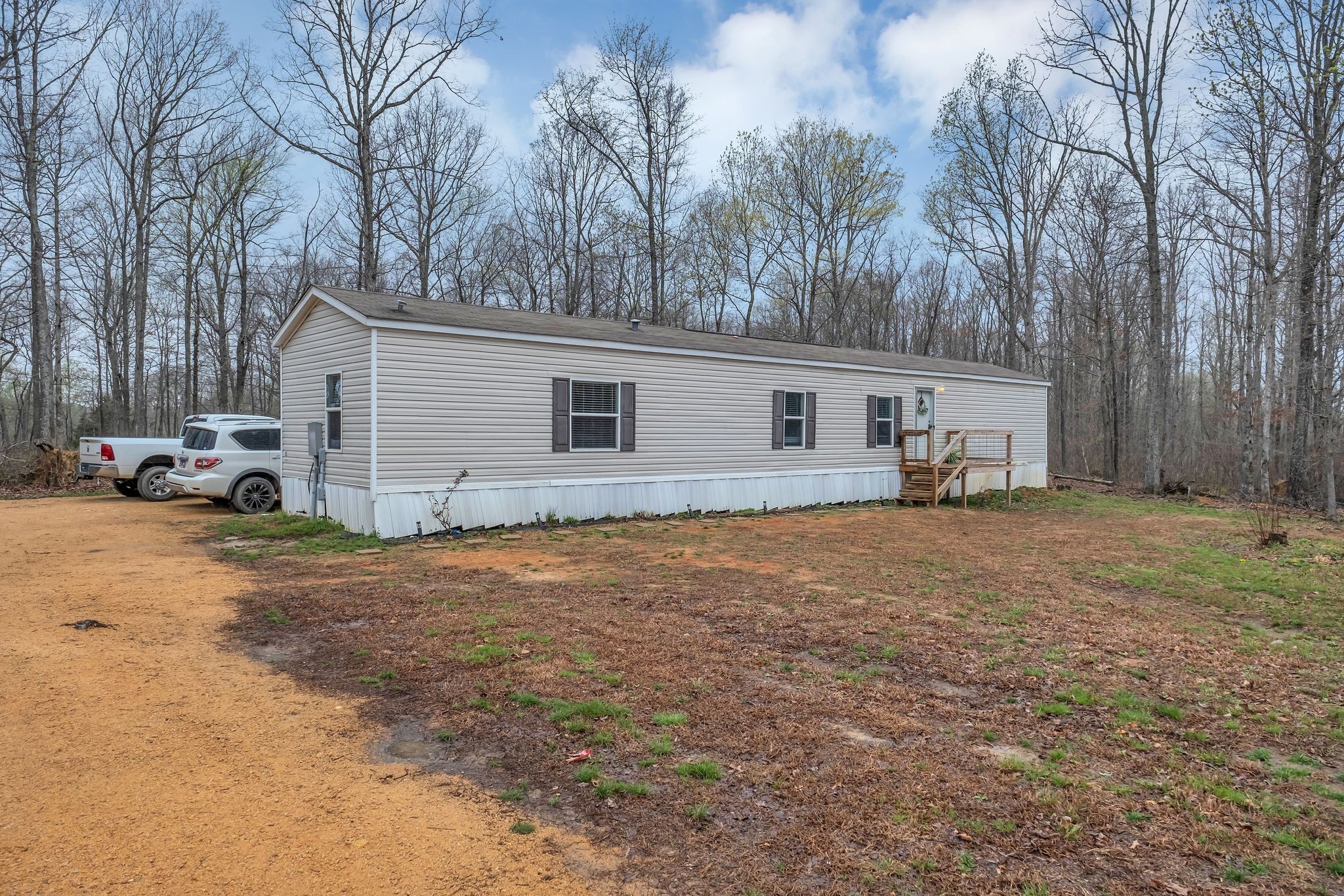 6126 Calvin Potts Road Primm Springs, TN 38476 - Photo 22 of 22 a front view of house with yard and trees in the background
