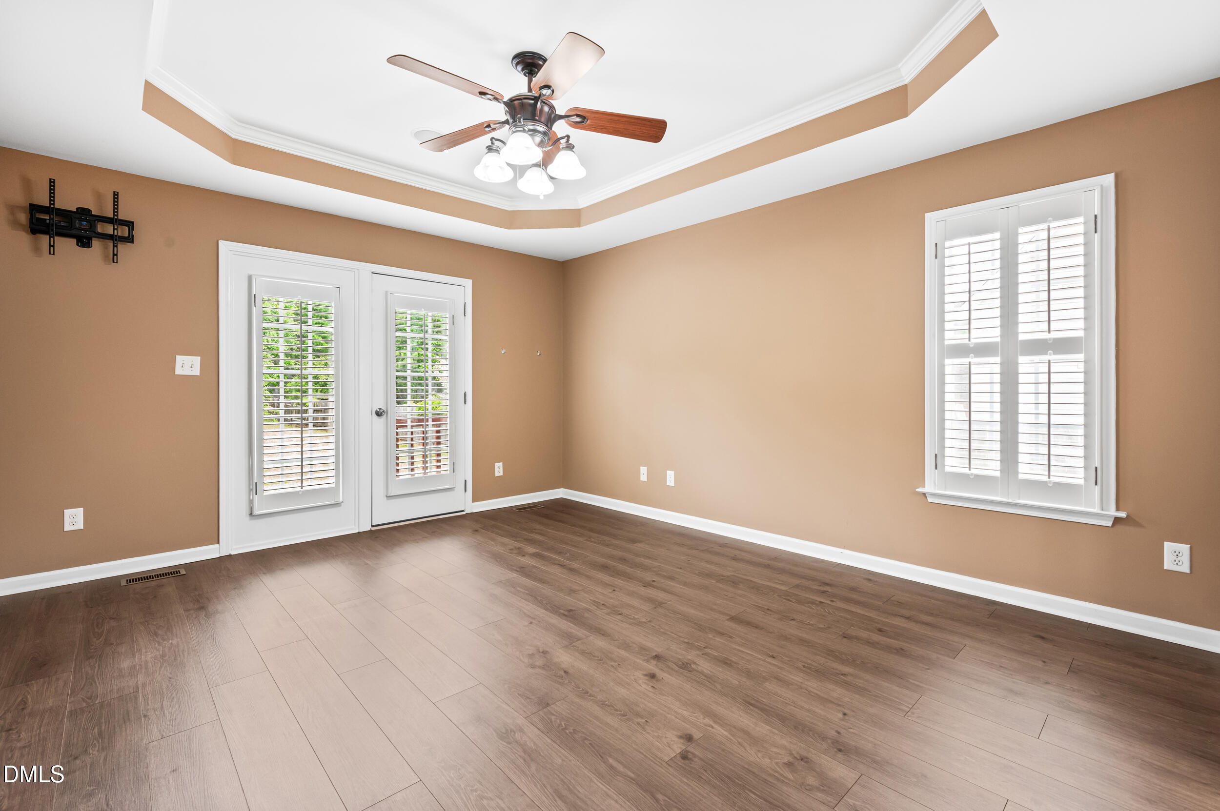 125 Rustic Lane Smithfield, NC 27577 - Photo 20 of 49 a view of an empty room with a window and wooden floor
