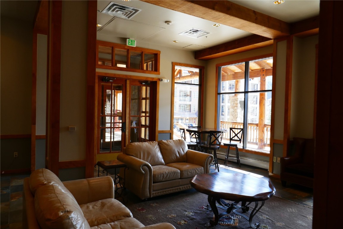 100 Dercum Square, Unit 8374 Keystone, CO 80435 - Photo 16 of 24 a living room with furniture and floor to ceiling windows