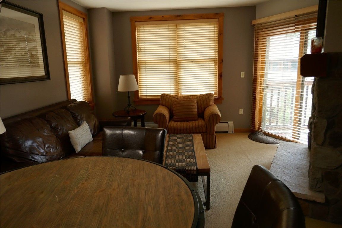 100 Dercum Square, Unit 8374 Keystone, CO 80435 - Photo 2 of 24 a living room with furniture and large windows
