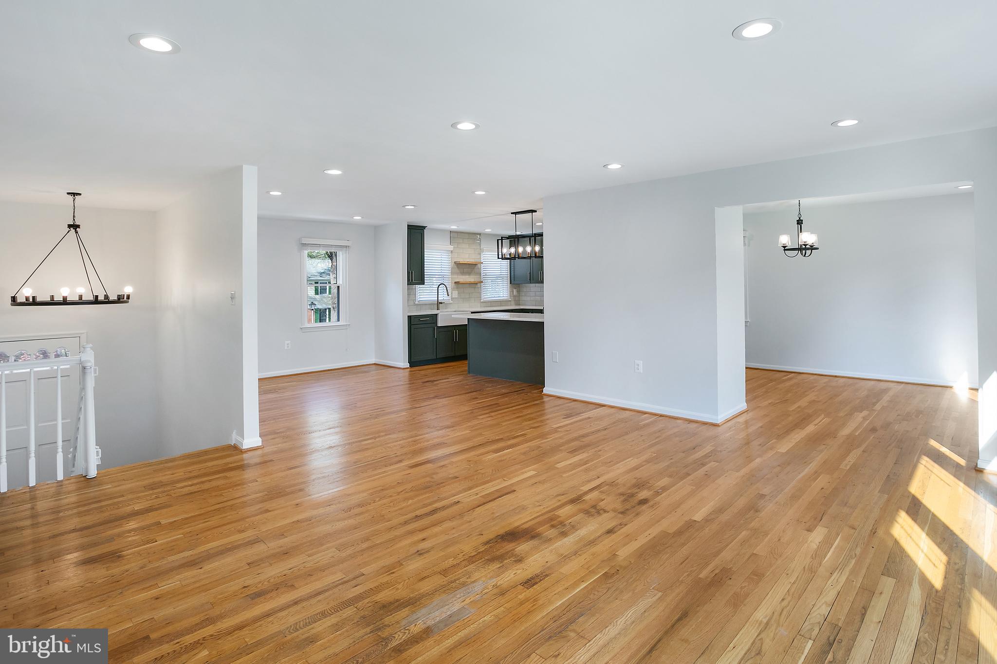 1420 Billman Lane Silver Spring, MD 20902 - Photo 5 of 44 a view of a kitchen and an empty room with wooden floor