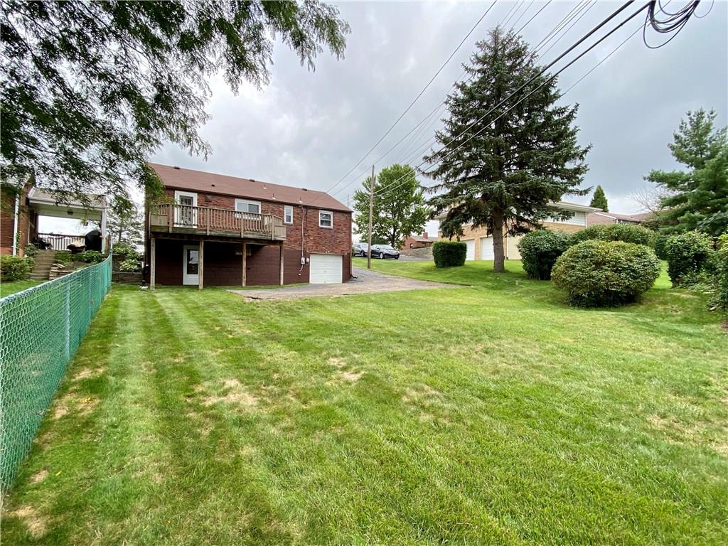 4224 Greenridge Road Pittsburgh, PA 15234 - Photo 22 of 25 View of home from the end of the level back yard.