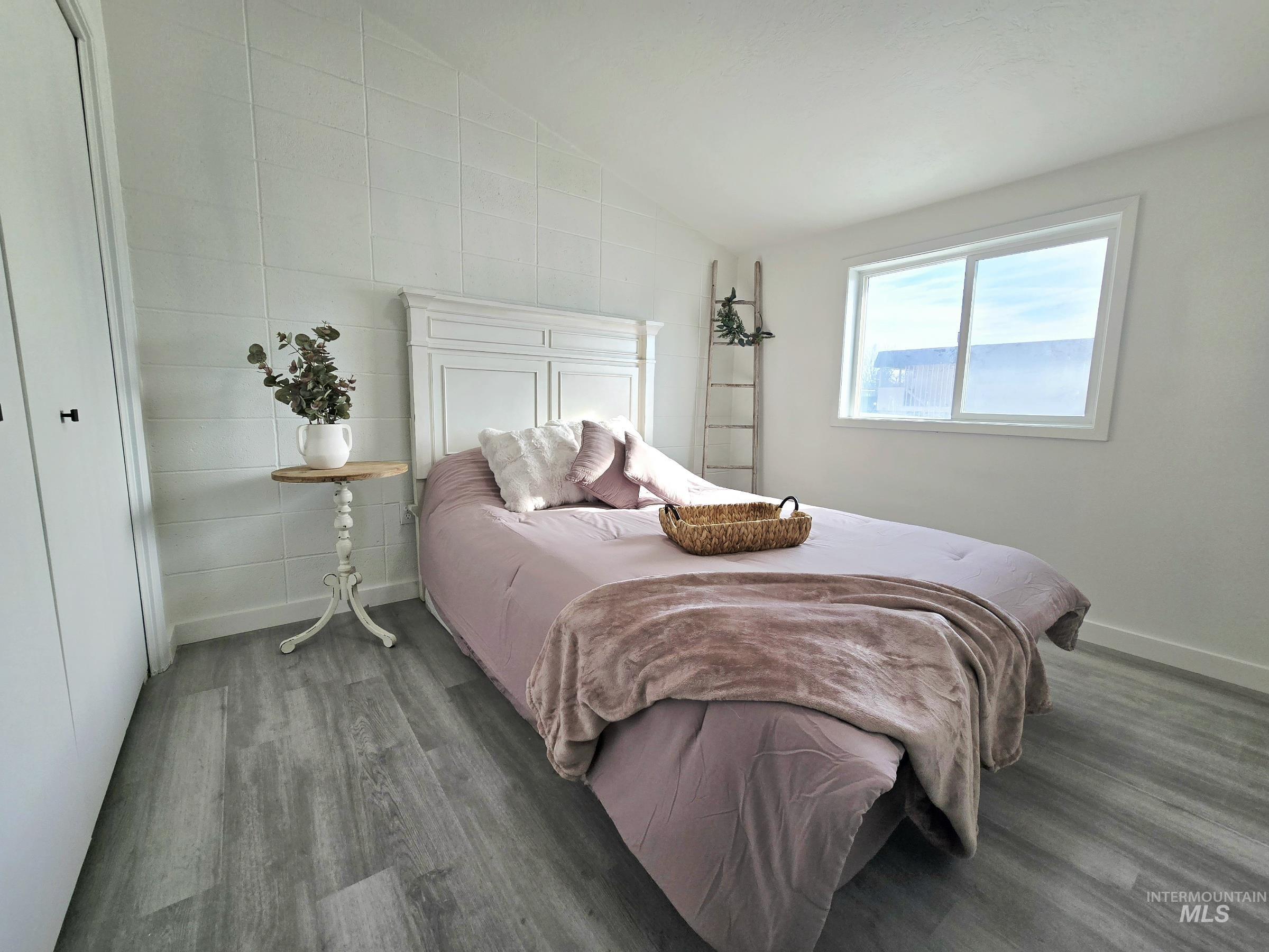 728 Northwest 8th Street Meridian, ID 83642 - Photo 11 of 18 Bedroom featuring lofted ceiling, dark wood-type flooring, and a closet