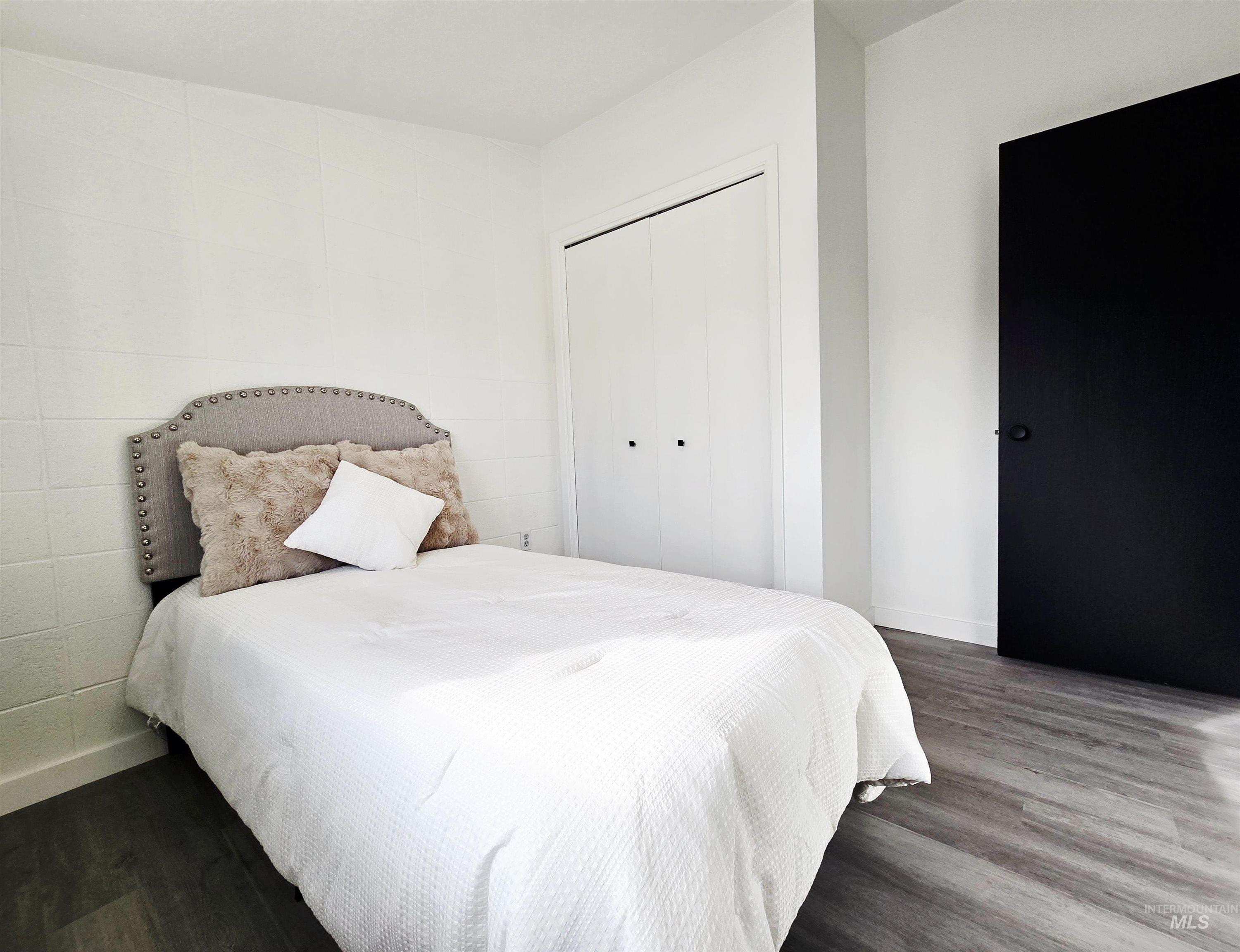 728 Northwest 8th Street Meridian, ID 83642 - Photo 14 of 18 Bedroom featuring wood finished floors and a closet