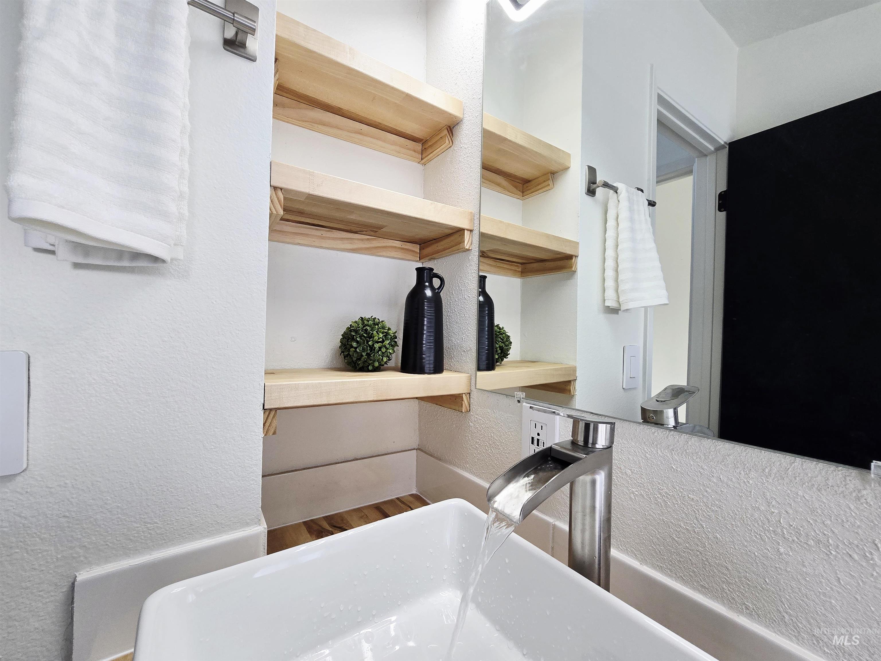 728 Northwest 8th Street Meridian, ID 83642 - Photo 17 of 18 Kitchen with a textured wall and wood finished floors