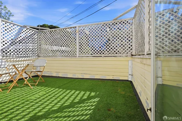 a view of a backyard with a chair