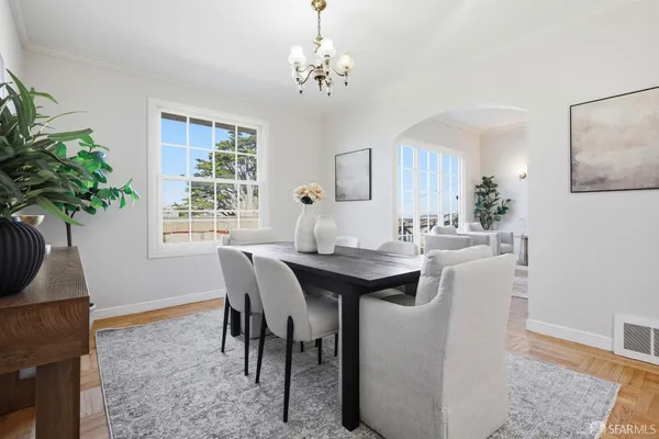 a dining room with a table and chairs
