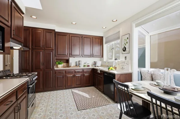 a kitchen with a sink stove and refrigerator