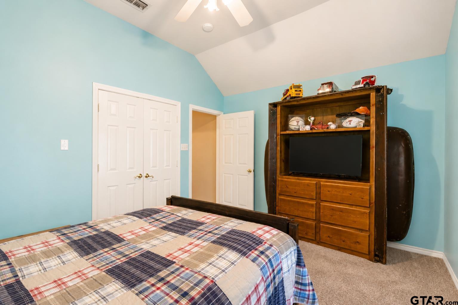 1388 Santa Fe Trail Tyler, TX 75703 - Photo 41 of 46 a bedroom with a bed and a television