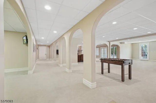 a view of a roof deck with table and chairs with wooden floor