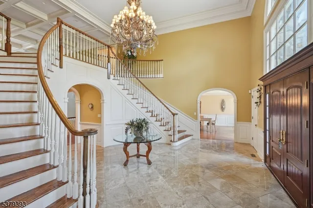 a view of entryway and hall with a front door