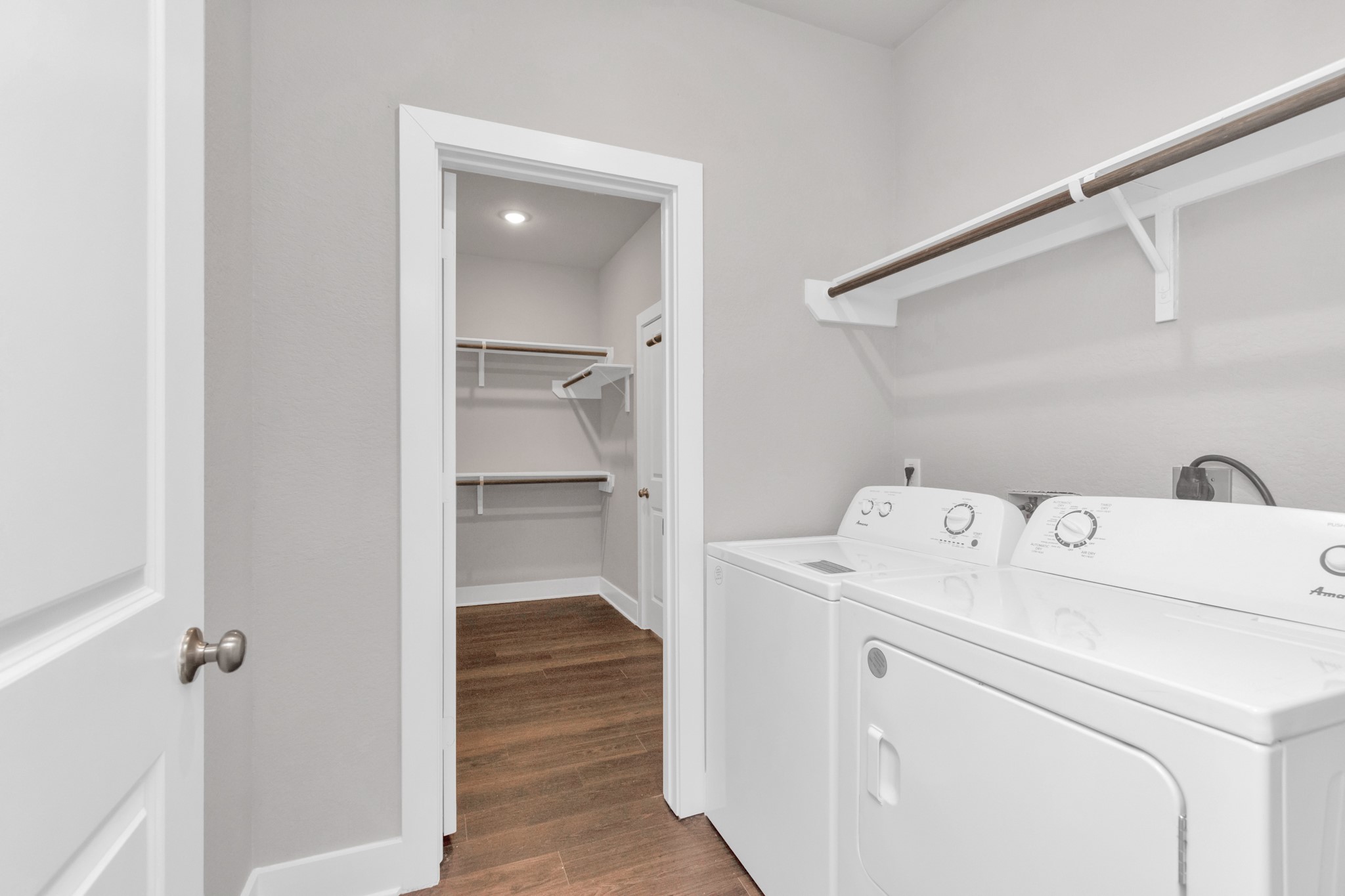 10502 Moon Valley Lane Rosharon, TX 77583 - Photo 15 of 23 a view of washer and dryer with bathroom in the background