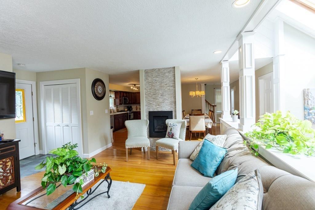 50 Forest Street Bridgewater, MA 02324 - Photo 11 of 42 a living room with fireplace furniture and a large window